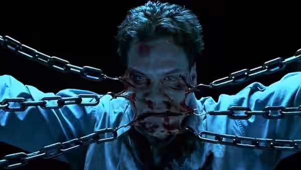 Det. Joseph Thorne (Craig Sheffer) bound by chains across his face