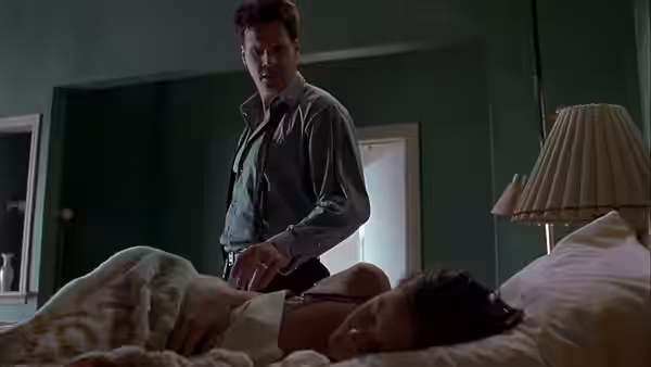 Det. Joseph Thorne (Craig Sheffer) standing beside a woman in bed