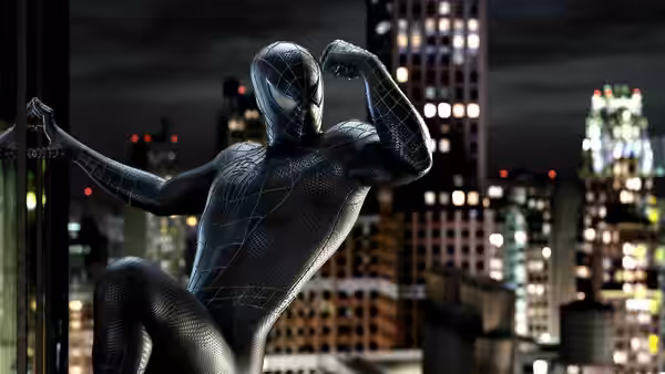 Black-suited Spider-Man flexes one arm against the nighttime city skyline