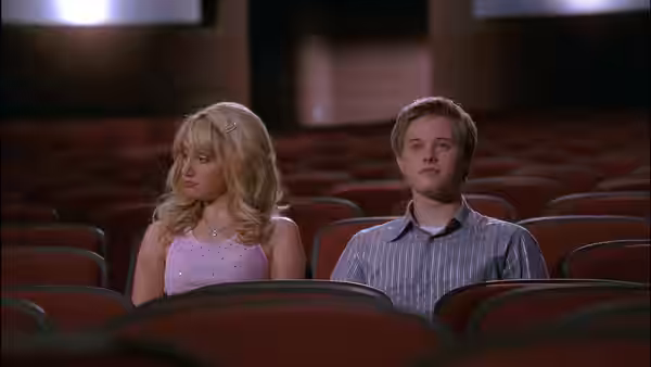 Sharpay (Ashley Tisdale) and Ryan (Lucas Grabeel) seated in auditorium rows