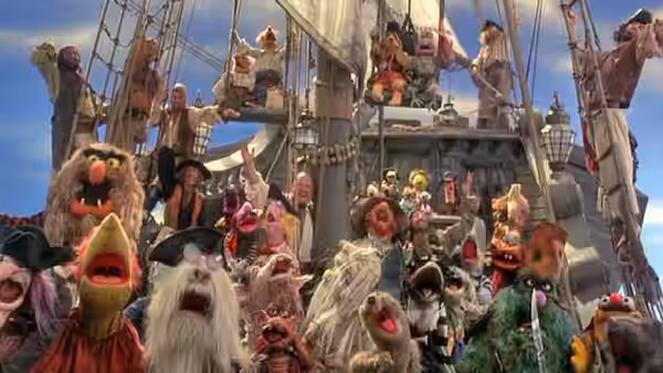 Crowd of Muppet pirates waving and shouting from the ship's rigging