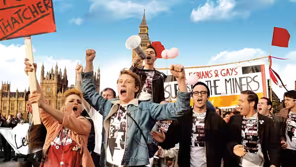 Protesters cheer with raised fists outside the Houses of Parliament