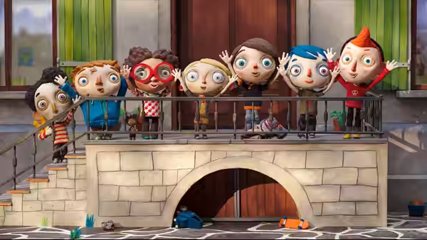 Children waving from behind a railing above a stone archway