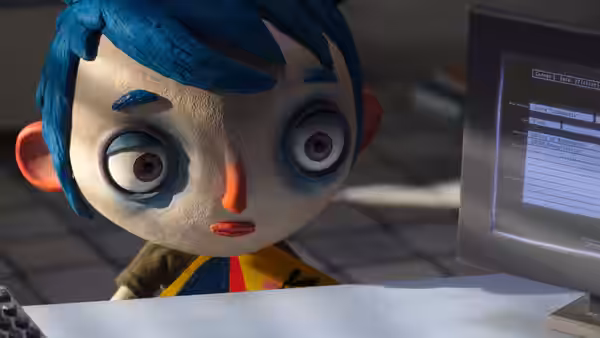 Courgette (Gaspard Schlatter) staring at a computer monitor