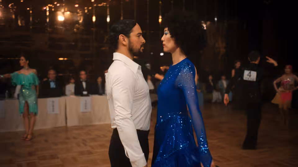 Haru (Rinko Kikuchi) and Fedir (Alberto Guerra) dancing closely on the floor