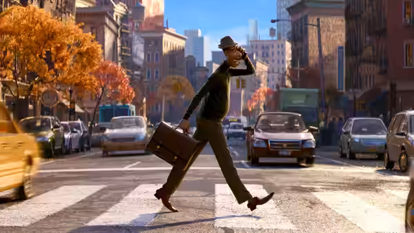 Joe Gardner crossing a city street while carrying a briefcase