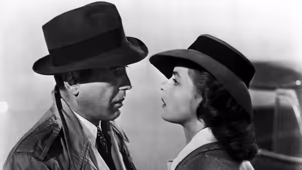 Rick Blaine (Humphrey Bogart) and Ilsa Lund (Ingrid Bergman) face each other closely outdoors
