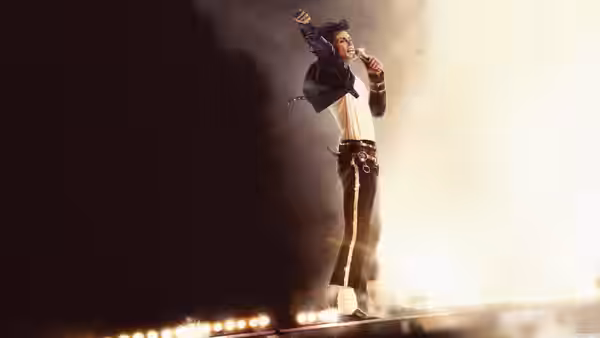 Michael (Jaafar Jackson) posing with microphone on a smoky stage