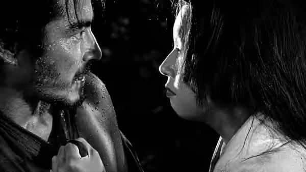 Tajômaru (Toshirō Mifune) and Masako (Machiko Kyō) facing each other closely