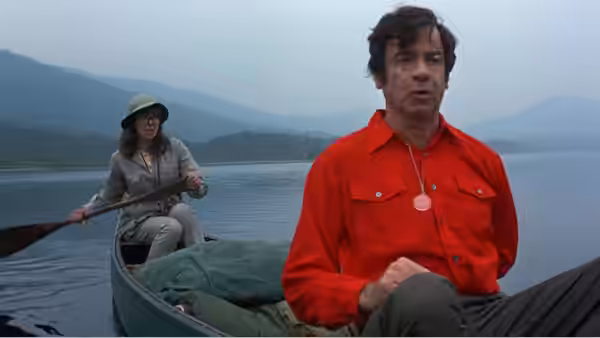 Henrietta Lowell (Elaine May) rows Henry Graham (Walter Matthau) across a lake in a canoe