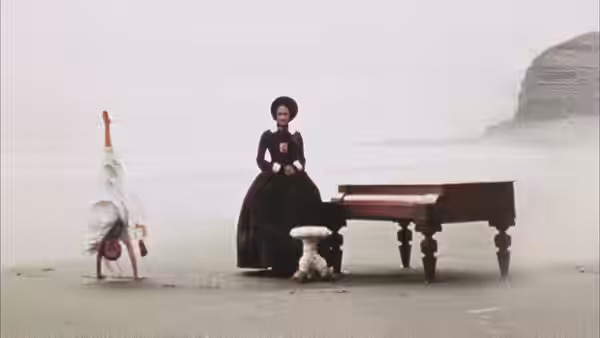 Ada McGrath (Holly Hunter) beside the piano on the beach watching Flora (Anna Paquin) handstand