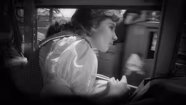 Veronika (Tatyana Samoylova) sits by a train window, looking outside