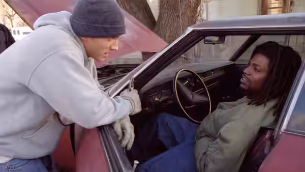 Jimmy (Eminem) leaning into a car talking to Future (Mekhi Phifer)