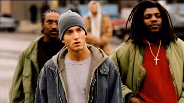 Jimmy (Eminem) walking on the street between two friends
