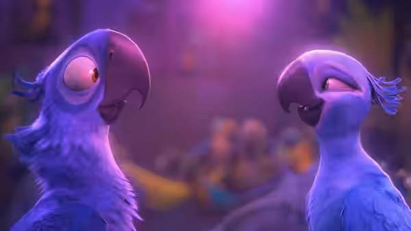Two blue macaws face each other closely in a softly lit setting