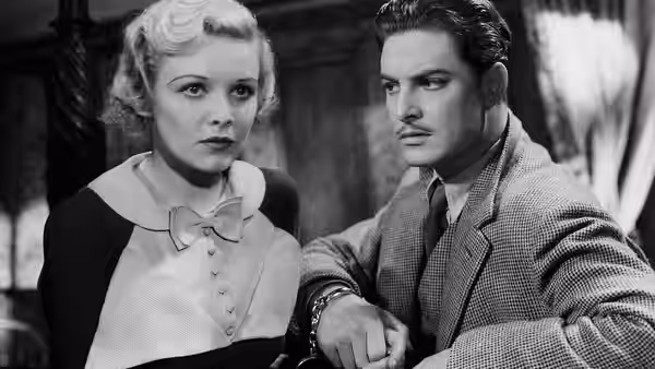 Pamela (Madeleine Carroll) and Richard Hannay (Robert Donat) sitting side by side