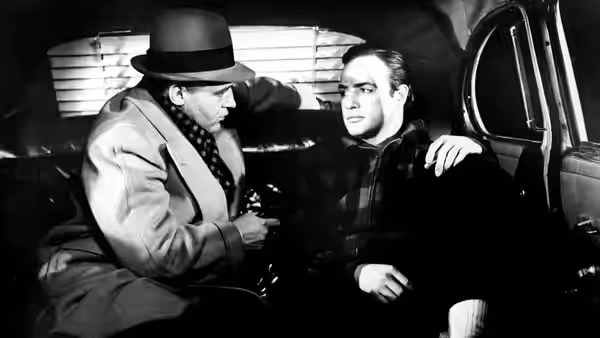 Johnny Friendly (Lee J. Cobb) confronting Terry Malloy (Marlon Brando) inside a car