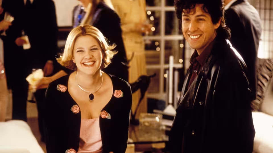 Robbie Hart (Adam Sandler) and Julia Sullivan (Drew Barrymore) smiling at a party