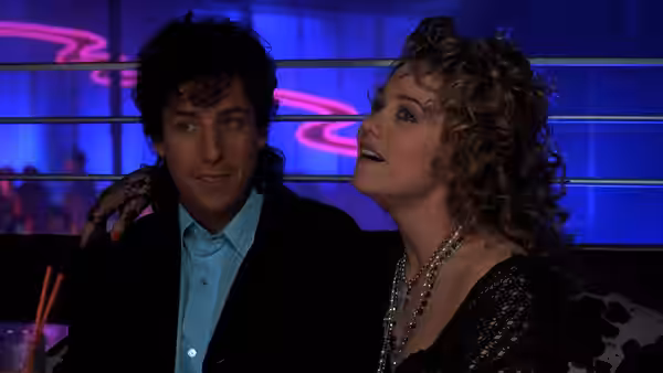 Robbie Hart (Adam Sandler) with Holly Sullivan (Christine Taylor) at a neon-lit bar