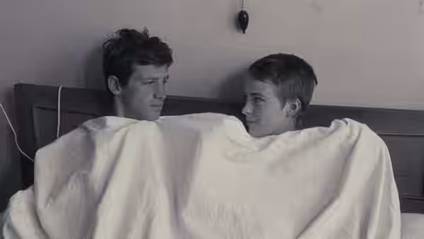 Michel (Jean-Paul Belmondo) and Patricia (Jean Seberg) lie together in bed