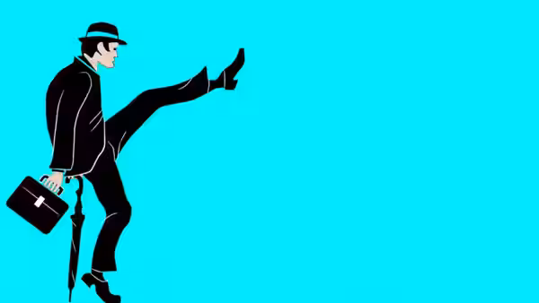 Man in bowler hat and suit kicks one leg high holding briefcase
