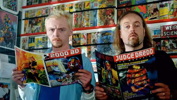 Tim Bisley (Simon Pegg) and Mike Watt (Nick Frost) holding comic books