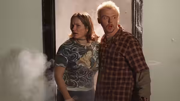 Daisy Steiner (Jessica Hynes) and Tim Bisley (Simon Pegg) amid smoke