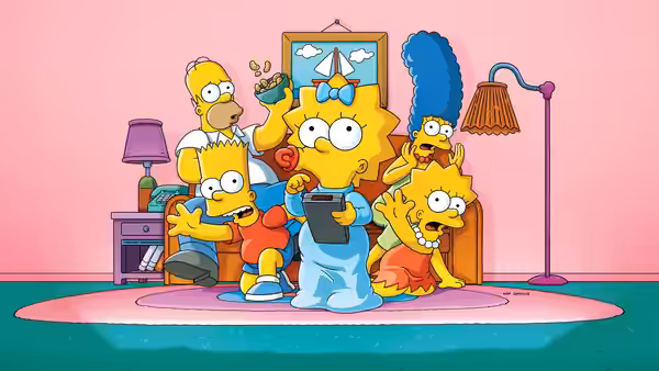 Bart Simpson showing a tablet to the excited Simpson family on the floor