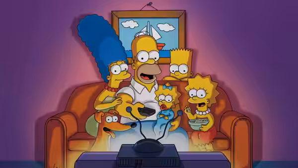 The Simpson family watching television together on the couch in the dark
