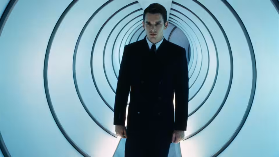 Vincent Freeman (Ethan Hawke) stands in a circular white corridor