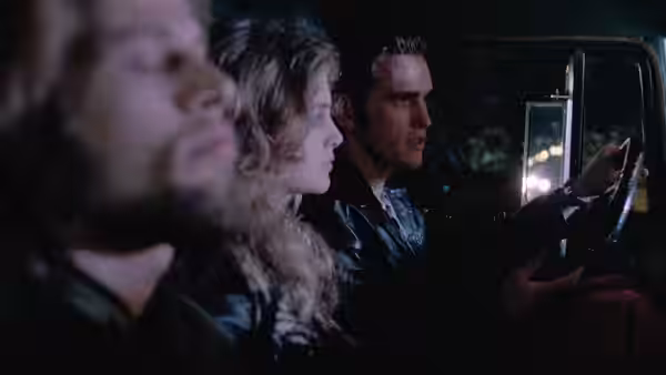 Bob (Matt Dillon) drives a van at night with Nadine (Heather Graham) beside him