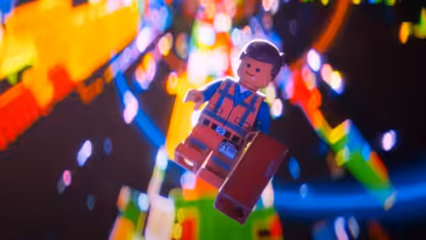 Emmet Brickowski (Chris Pratt) floats through glowing colorful bricks with toolbox