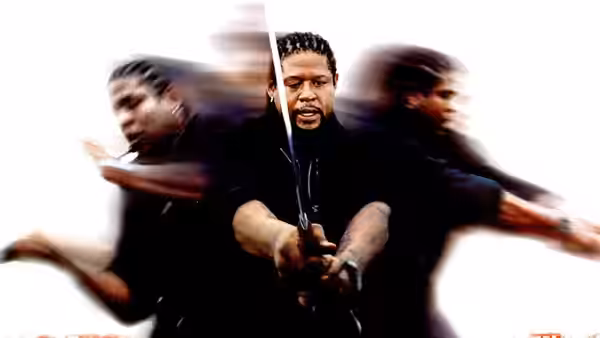 Ghost Dog (Forest Whitaker) holding a sword in a dynamic pose