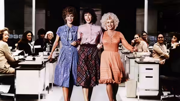 Violet Newstead (Lily Tomlin), Judy Bernly (Jane Fonda), and Doralee Rhodes (Dolly Parton) stride through the office