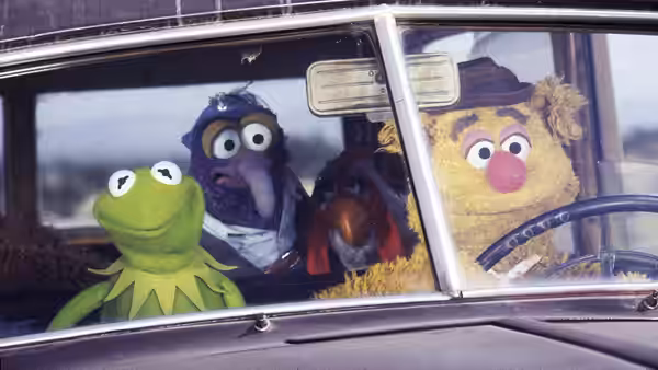 Kermit, Dr. Teeth, Gonzo, and Fozzie ride together in a car