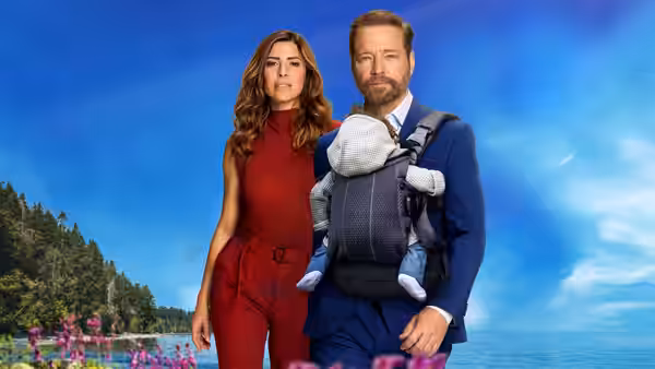 Angie Everett (Cindy Sampson) and Matt Shade (Jason Priestley) stand together as he carries a baby