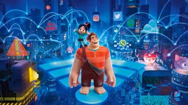 Ralph (John C. Reilly) standing on a platform with Vanellope (Sarah Silverman) on his shoulder