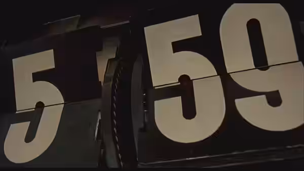 Split flap display showing large white digits five and fifty nine