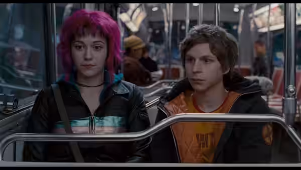 Ramona Flowers (Mary Elizabeth Winstead) and Scott Pilgrim (Michael Cera) seated on public transit