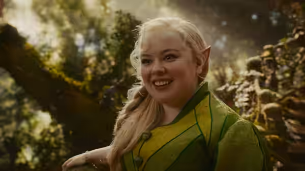 Silky (Nicola Coughlan) smiling in a sunlit forest