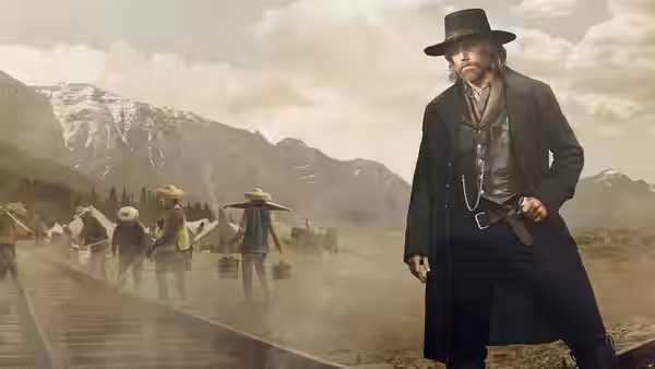 Cullen Bohannan stands by a railway track as workers build across a mountain valley
