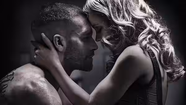 Billy Hope (Jake Gyllenhaal) and Maureen Hope (Rachel McAdams) embrace face to face