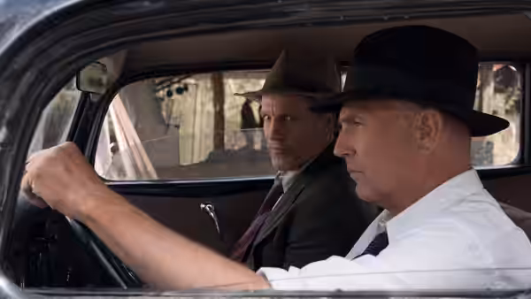 Frank Hamer (Kevin Costner) drives while Manny Gault (Woody Harrelson) rides beside him