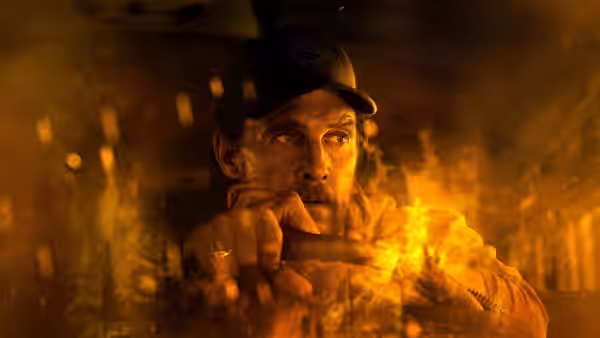 Kevin McKay (Matthew McConaughey) steers through flames and smoke inside the bus