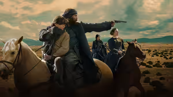 A bearded rider points a pistol across the plains, with a child beside him on horseback