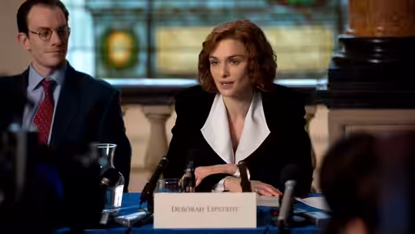 Deborah Lipstadt (Rachel Weisz) sits at a conference table beside her nameplate