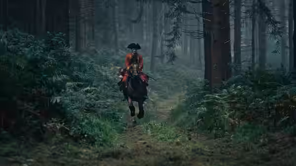 George Washington (William Franklyn-Miller) rides a horse along a forest path