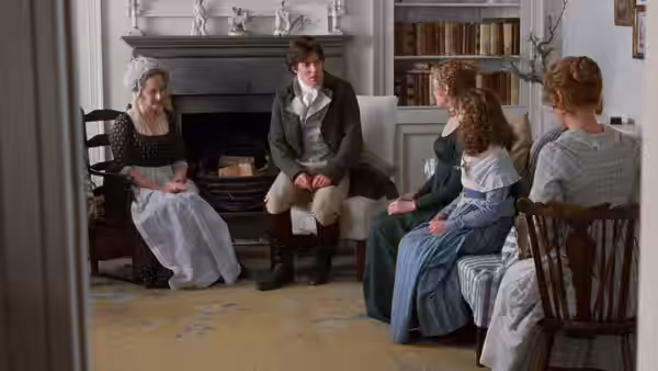 Mrs Dashwood (Gemma Jones) seated with Edward Ferrars and the Dashwood sisters in a drawing room