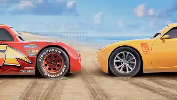 Lightning McQueen and Cruz Ramirez line up side by side on the racetrack