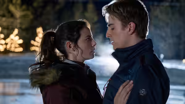 Katarina Baker (Kaya Scodelario) and Justin Davis (Evan Roderick) face each other outdoors beside the rink